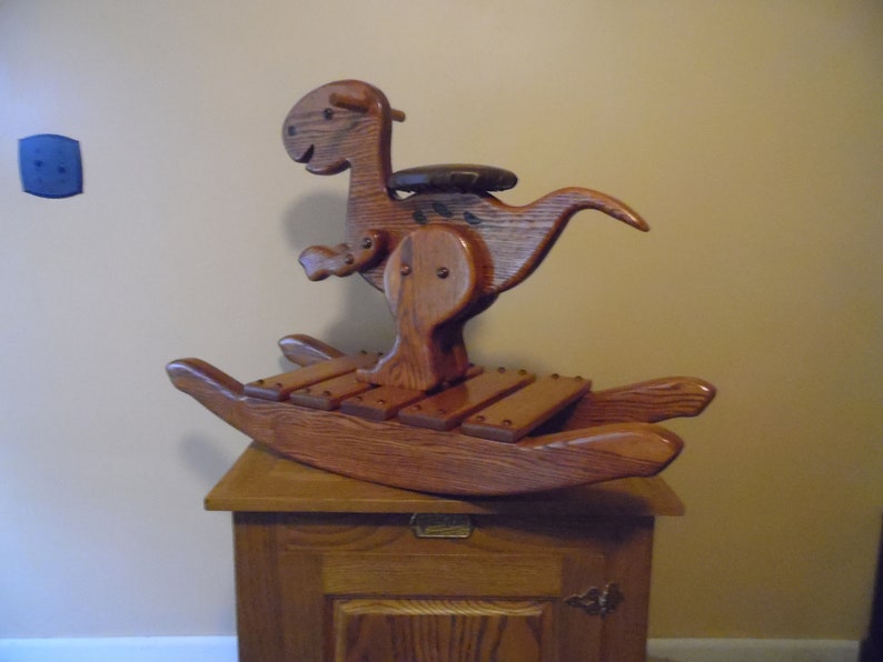 wooden rocking dinosaur