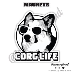 May include: Black and white illustration of a corgi wearing sunglasses with the text "CORG LIFE" and the social media handle "@teamcorgibrand".