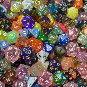 May include: A vibrant assortment of polyhedral dice in various colors and materials. The dice are scattered, showcasing different shapes and numbers, including D4, D6, D8, D10, D12, and D20. The collection includes transparent, opaque, and glittery dice.