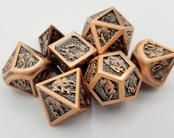 May include: Set of seven copper-colored polyhedral dice with intricate animal designs and numbers. The dice are made of metal and have a dark gray background within each face. Ideal for tabletop gaming.