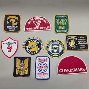 May include: A collection of ten embroidered security patches in various shapes and colours. The patches feature logos and text including Pinkerton, Vance Uniformed Protection Services, St. John's Meadows, Triple A Security Patrol, Zona Escolar, SOS Security Incorporated, McRoberts Protective Agency, Wilmorite Property Management Patrol, Amerisec, and Guardsmark.