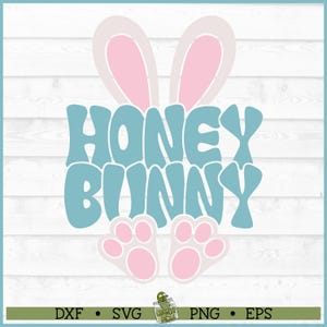 May include: A blue and white graphic design with the text "Honey Bunny" in a retro font. The design features two pink bunny ears and two pink paw prints.