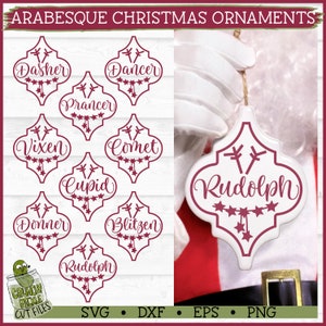 May include: A set of ten Christmas ornaments featuring the names of Santa's reindeer in a burgundy red color. The ornaments are shaped like a traditional Moroccan tile with a starburst design. The ornaments are perfect for adding a festive touch to your Christmas tree.
