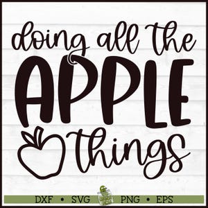 May include: Black and white graphic design with the words "doing all the APPLE things" in a whimsical font. An apple illustration is included. The design is on a white wooden background. The bottom of the image includes file type options.
