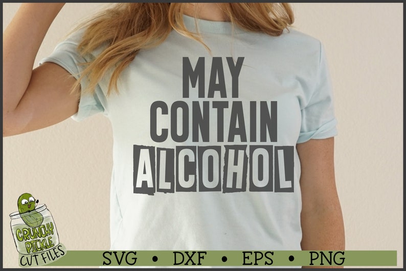 May include: A light blue t-shirt with the text "MAY CONTAIN ALCOHOL" printed in black and white. The text is in a distressed font style.