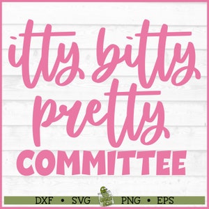 May include: Pink graphic text on a white wood background that reads "itty bitty pretty committee".
