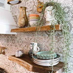 These HEAVY DUTY live edge floating shelves (floating bracket included) are handmade from SOLID 2" thick walnut. Use these floating shelves for storage, kitchen shelves or as a bookshelf. The possibilities are endless.