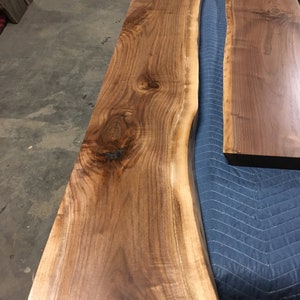 These HEAVY DUTY live edge floating shelves (floating bracket included) are handmade from SOLID 2" thick walnut. Use these floating shelves for storage, kitchen shelves or as a bookshelf. The possibilities are endless.