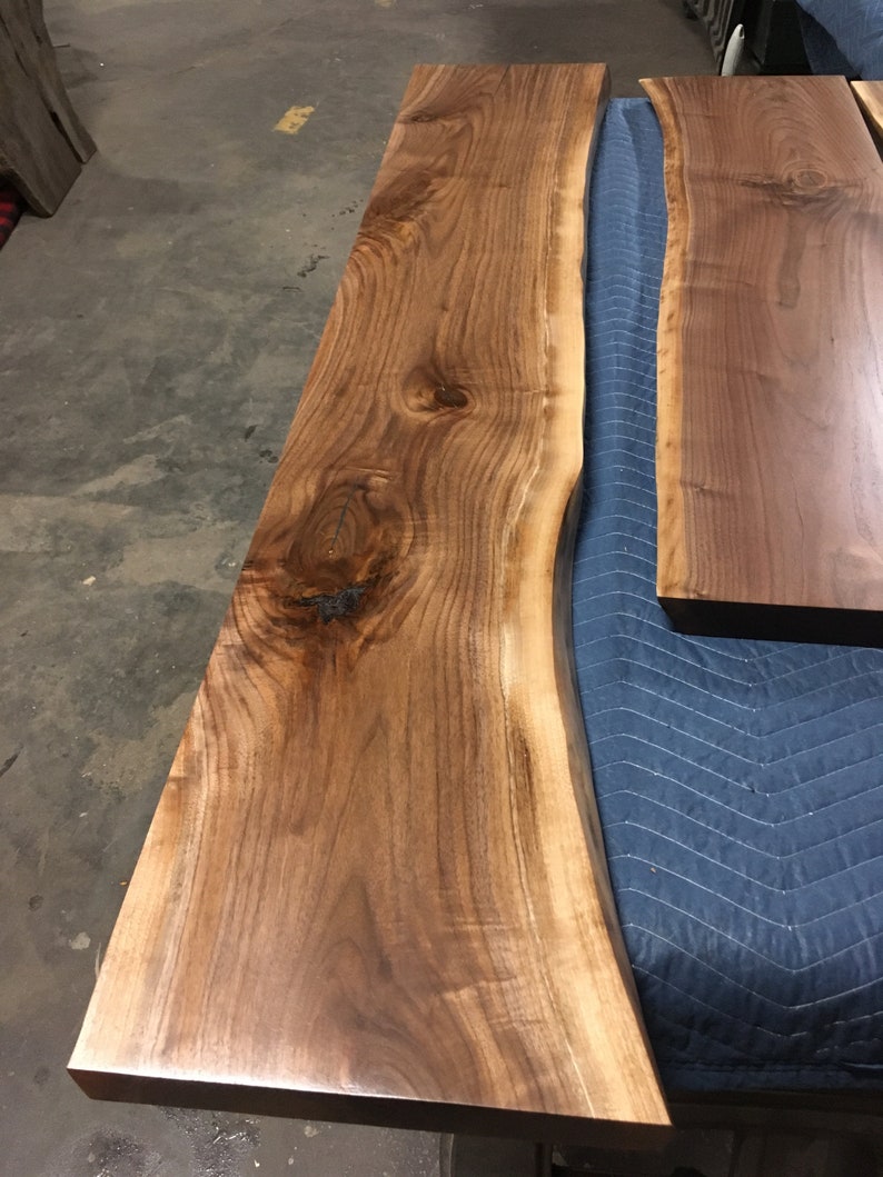 These HEAVY DUTY live edge floating shelves (floating bracket included) are handmade from SOLID 2" thick walnut. Use these floating shelves for storage, kitchen shelves or as a bookshelf. The possibilities are endless.