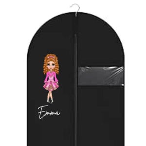 May include: Black garment bag featuring a cartoon girl in a pink dress. The name "Emma" is written in white script below the illustration. The bag includes a clear plastic window and a metal hanger.