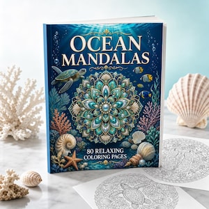 Puede incluir: Un libro para colorear titulado Ocean Mandalas con 80 páginas relajantes. La portada presenta un gran mandala turquesa y dorado, una tortuga marina, corales y conchas sobre un fondo submarino azul profundo con rayos de luz.
