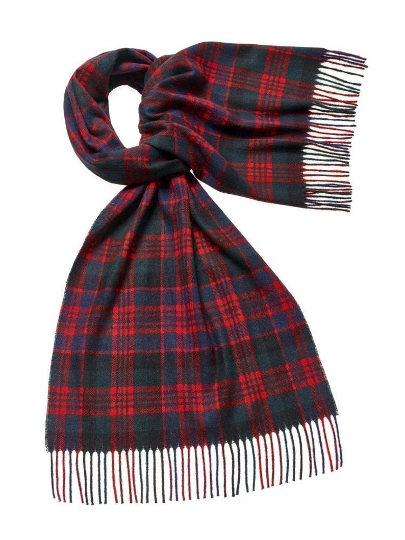 May include: A red, black, and green plaid scarf with fringe on the ends.
