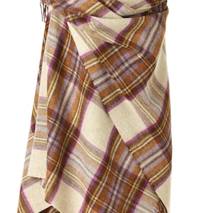 May include: A beige, brown, and purple plaid shawl with fringe on the edges. The shawl is draped over a wooden mannequin.