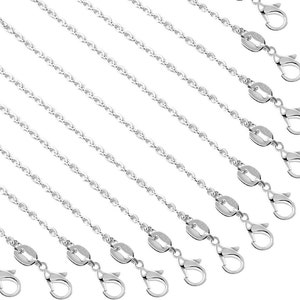 May include: A set of ten silver chain extenders with lobster claw clasps. Each extender is approximately 2 inches long.