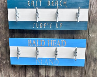 Custom engraved nautical towel rack for your home . Complete with four 4 inch boat cleats.  Personalize your favorite destinations.