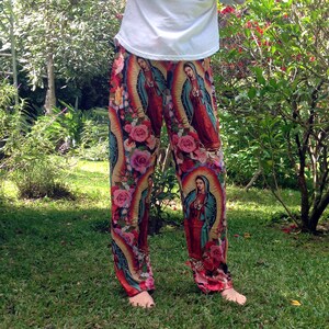 May include: Red, blue, and green pants with a floral pattern and images of the Virgin Mary.