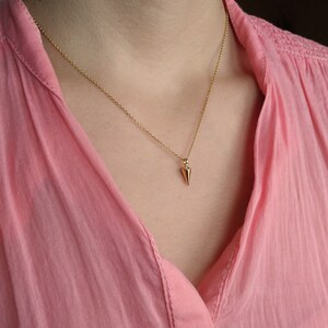 Women wears 9k rose gold solid spike necklace