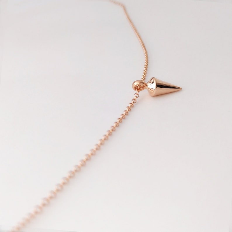 9k gold spike necklace chain passes through a bail