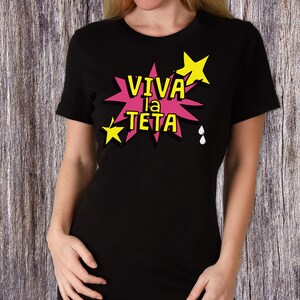 May include: Black t-shirt with a pink and yellow graphic that says "VIVA la TETA" with stars and drops.