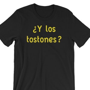 May include: Black t-shirt with the text "&iquest;Y los tostones?" in yellow.
