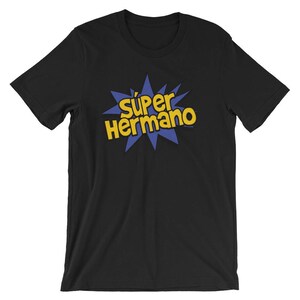 May include: Black t-shirt with the words "S&uacute;per Hermano" in yellow, outlined in blue, in a starburst design. The text is a Spanish phrase meaning "Super Brother".