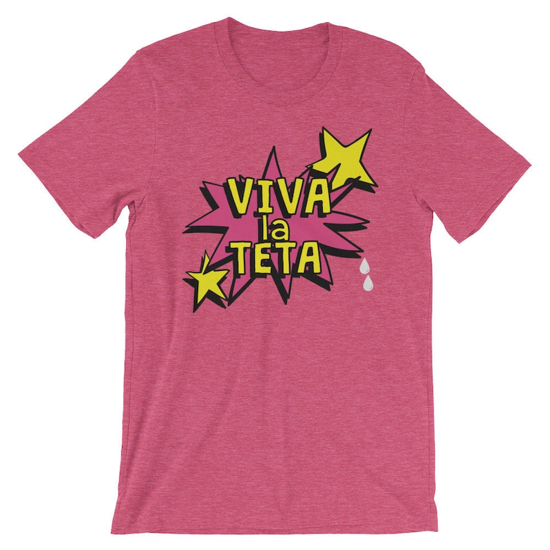 May include: Pink t-shirt with a yellow star and a pink speech bubble that says "Viva la Teta" in black text.