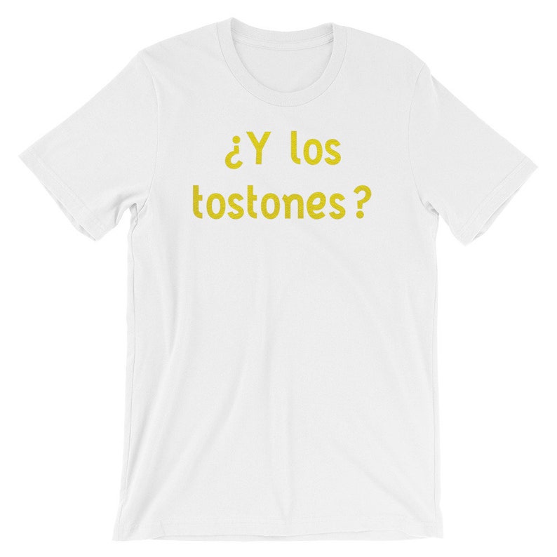 May include: White t-shirt with the text "&iquest;Y los tostones?" in yellow.