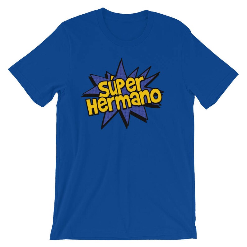May include: Royal blue t-shirt with the text "S&uacute;per Hermano" in yellow, outlined in black, within a starburst graphic. The shirt is a solid color, with short sleeves and a crew neck.