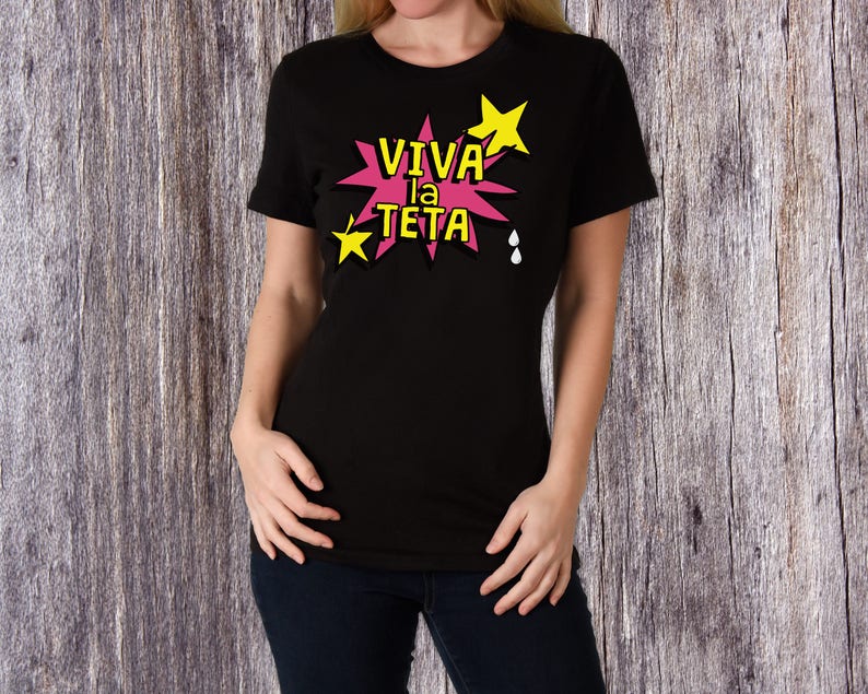 May include: Black t-shirt with a pink and yellow graphic that says "VIVA la TETA" with stars and drops.