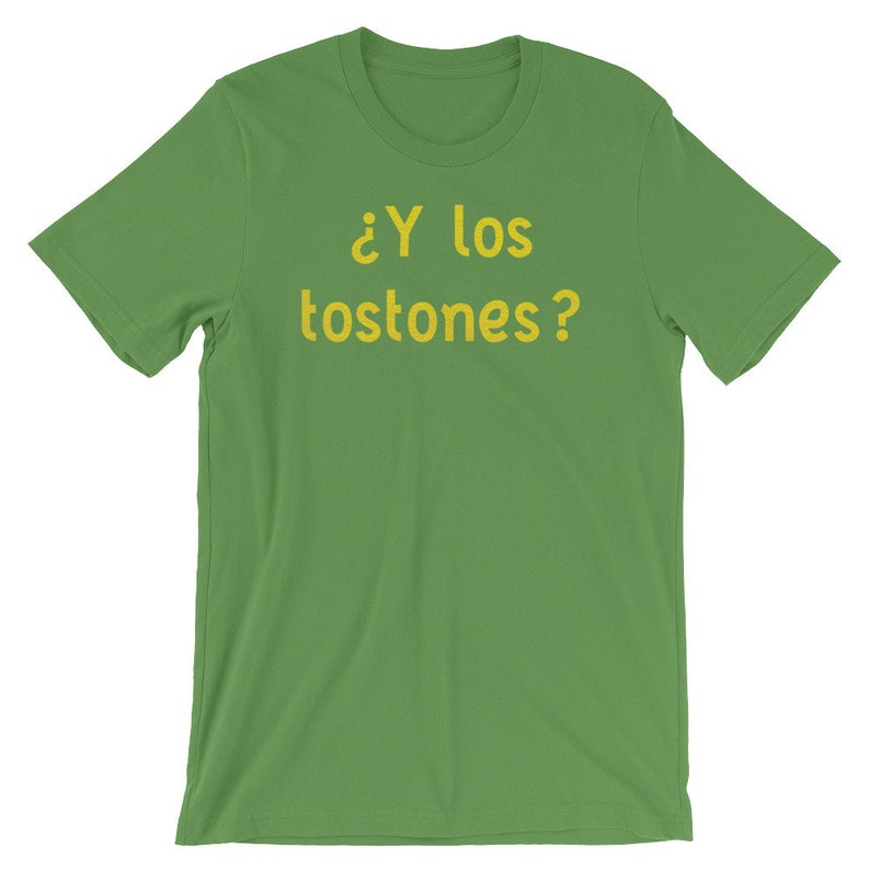 May include: Green t-shirt with the text "&iquest;Y los tostones?" in yellow.