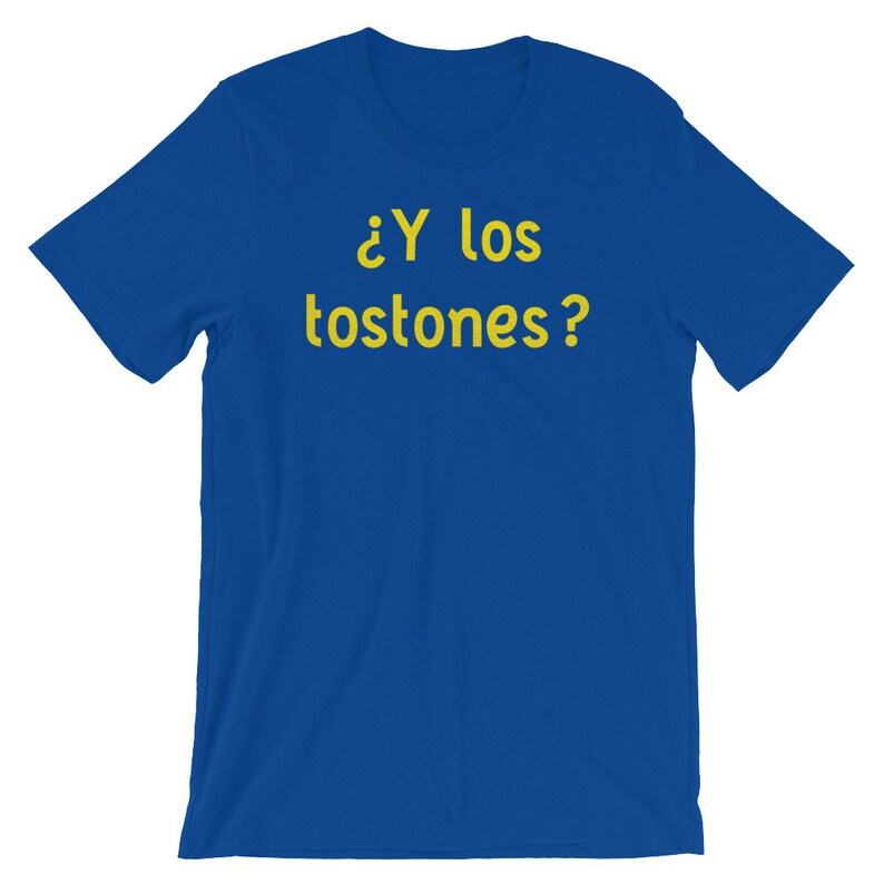 May include: A royal blue t-shirt with the text "&iquest;Y los tostones?" in yellow.