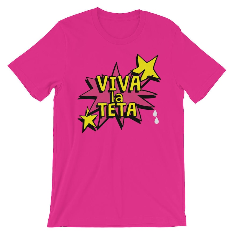 May include: Pink t-shirt with a yellow star and a speech bubble that says "Viva la Teta".