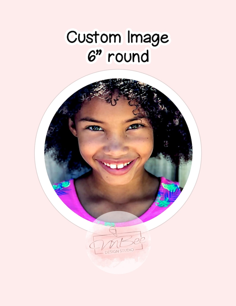 May include: A 6 inch round custom image sticker featuring a smiling young girl with curly hair wearing a pink and green patterned shirt. The sticker has a white border and a small logo in the bottom right corner that says "InBee Design Studio".