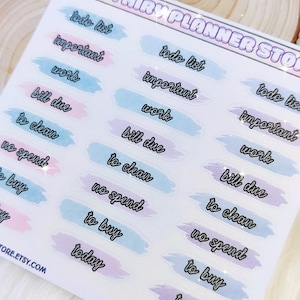 Può includere: Un foglio di adesivi per planner con frasi come "todo list", "important" e "work". Gli adesivi hanno un design a pennellate acquerellate in blu pastello, rosa e viola. Il testo "NY FAIRY PLANNER STORE" è in alto.
