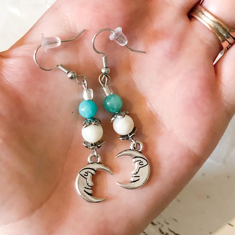 and silver moon dangle earrings. Teal cream