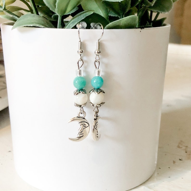 and silver moon dangle earrings. Teal cream