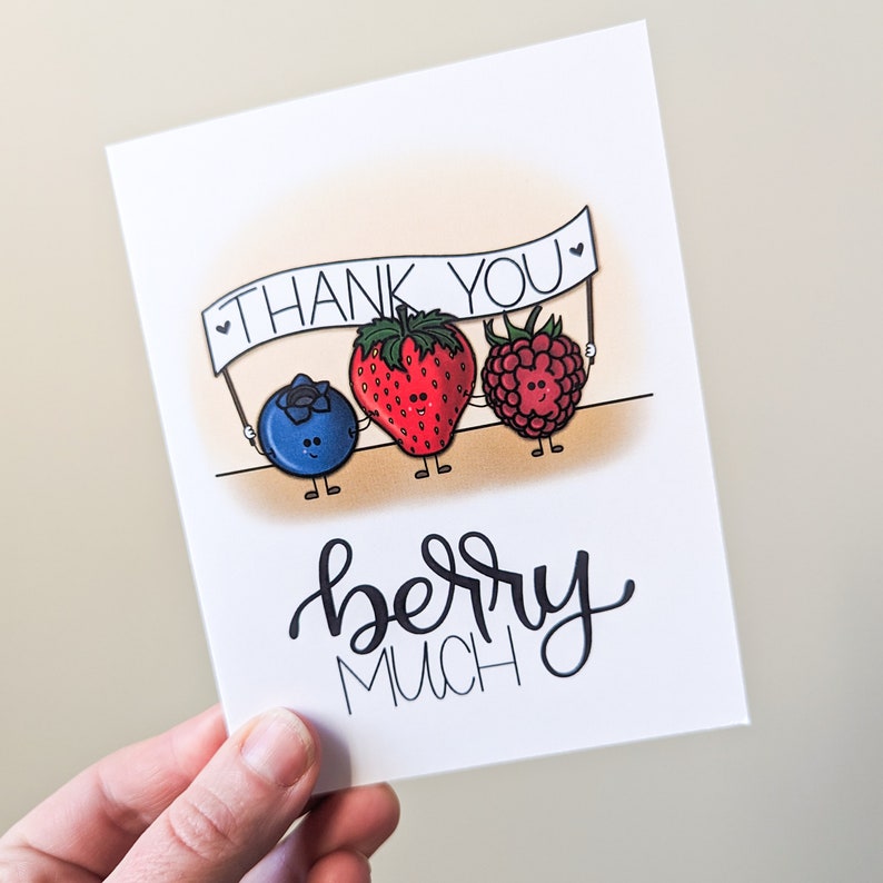 Blueberry strawberry and raspberry characters holding a white thank you banner with words below that say berry much