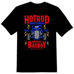 May include: Black t-shirt with a graphic of a blue hot rod car with the text "HOTROD TWISTED MANIAC" above the car and "AMERICA'S BADBOY CUSTOM CLASSIC" below the car.
