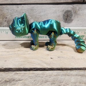 Flexing factory 3D Printed pink Cat Kitten with moving parts.