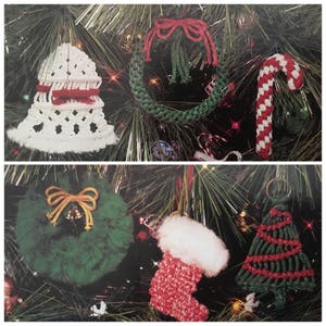 May include: A collection of six handmade Christmas decorations made with yarn. The decorations include a bell, a wreath, a candy cane, a stocking, a Christmas tree, and another wreath with a bell.