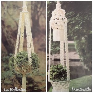 May include: Two macrame plant hangers, one called "La Ballerine" and the other called "Marionette", are shown hanging from the ceiling with plants inside. Both hangers are made of white cord and have a decorative design.