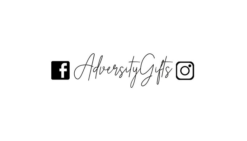 May include: White background with the text "Adversity Gifts" in a cursive font. A black Facebook logo is on the left, and a black Instagram logo is on the right.