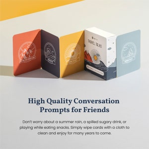 May include: A set of conversation starter cards with colorful illustrations and the text "TRAVEL TALKS" on the front. The cards are designed to help friends connect and have meaningful conversations.