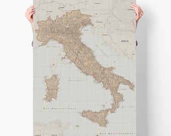 May include: A vintage-style map of Italy with a grid pattern and the names of cities and regions printed in brown text. The map is printed on a light gray background.