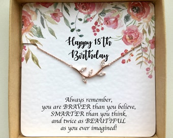 May include: A rose gold necklace with a delicate branch design and clear stones in a gift box with a floral pattern and the text "Happy 18th Birthday" and "Always remember, you are BRAVER than you believe, SMARTER than you think, and twice as BEAUTIFUL as you ever imagined!"