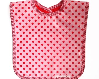 Baby bib in candy pink fabric with red polka dots, 0/9 months