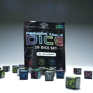 May include: A black plastic pouch labeled Periodic Table Dice 20 Dice Set All 118 Elements with several small black dice scattered in front. Each die features a chemical element symbol and atomic number in various colors like green, blue, and red.