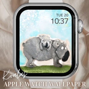 Könnte beinhalten: Apple Watch Zifferblatt mit einer digitalen Uhr, die "TUE 20 10:37" anzeigt, und einer Cartoon-Illustration von zwei Koalas. Der Hintergrund ist ein hellblauer Aquarell-Wasch mit weißen Glitzerpartikeln.
