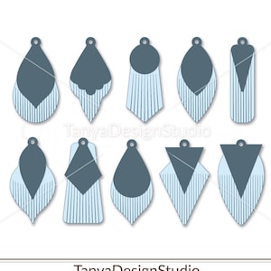 May include: A collection of ten gray and light blue earring designs. Each earring features a unique shape, with a solid gray top section and a striped light blue bottom section. The designs include teardrops, rectangles, and geometric shapes. The text "TanyaDesignStudio" is visible.