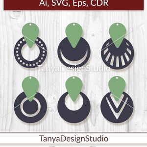 May include: Six earring designs in black and green, each with a unique circular or crescent shape. The designs include dotted, striped, and solid patterns. The text "Ai, SVG, Eps, CDR" is at the top, and "TanyaDesignStudio" is at the bottom.